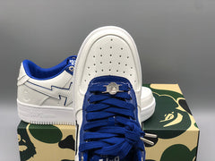 A Bathing APE white & navy patent leather sneakers